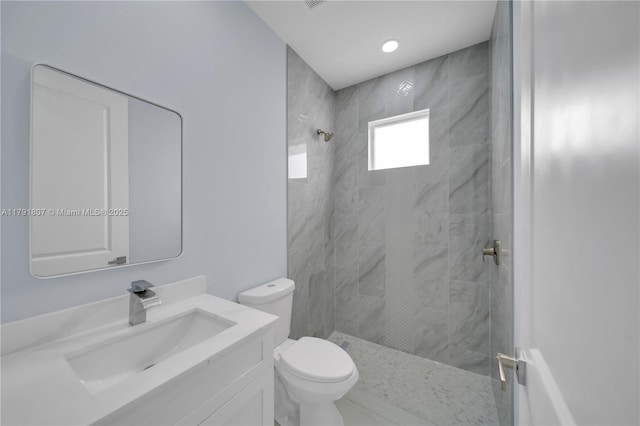 516 Millcreek St, Lehigh Acres, FL 33974 - full bath featuring vanity, a tile shower, and toilet