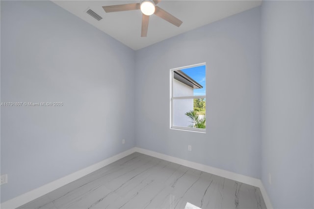 516 Millcreek St, Lehigh Acres, FL 33974 - unfurnished room with a ceiling fan, baseboards, visible vents, and marble finish floor