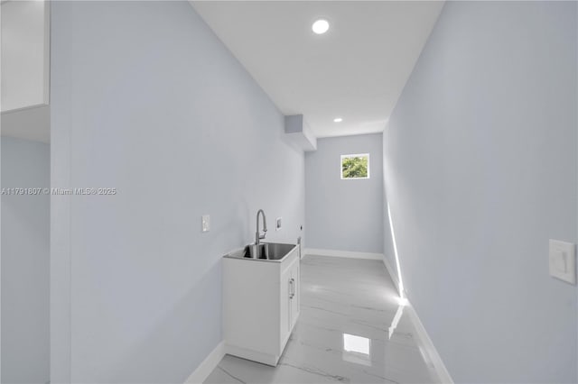 516 Millcreek St, Lehigh Acres, FL 33974 - hallway featuring recessed lighting, baseboards, a sink, and marble finish floor