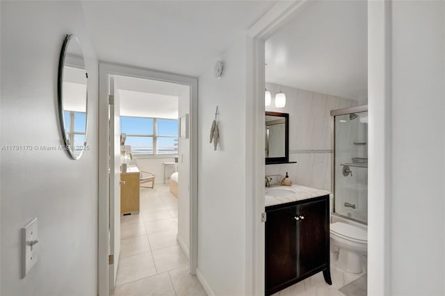 full bath with vanity, tile patterned flooring, and toilet