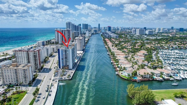 bird's eye view featuring a view of city and a water view