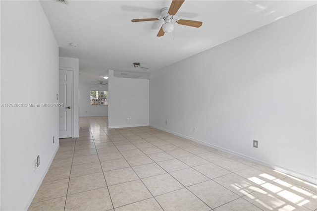 330 SW 2nd Ave Unit 3, Hallandale Beach, FL 33009 - spare room with light tile patterned flooring, ceiling fan, and baseboards