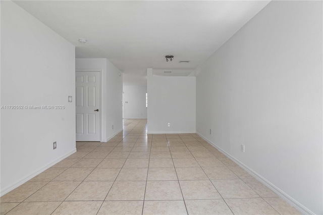 330 SW 2nd Ave Unit 3, Hallandale Beach, FL 33009 - empty room with light tile patterned floors and baseboards