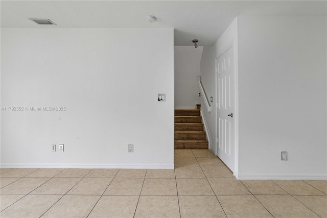 330 SW 2nd Ave Unit 3, Hallandale Beach, FL 33009 - unfurnished room with baseboards, stairs, light tile patterned floors, and visible vents
