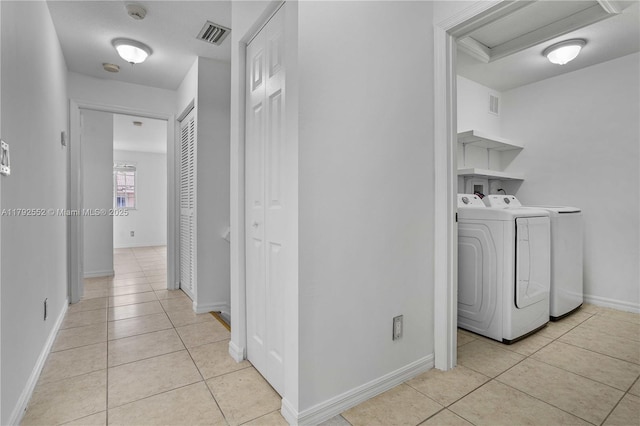 330 SW 2nd Ave Unit 3, Hallandale Beach, FL 33009 - hall with light tile patterned floors, washing machine and dryer, and visible vents