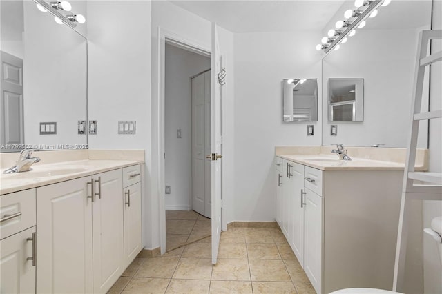 330 SW 2nd Ave Unit 3, Hallandale Beach, FL 33009 - full bath with a sink, tile patterned flooring, toilet, and two vanities