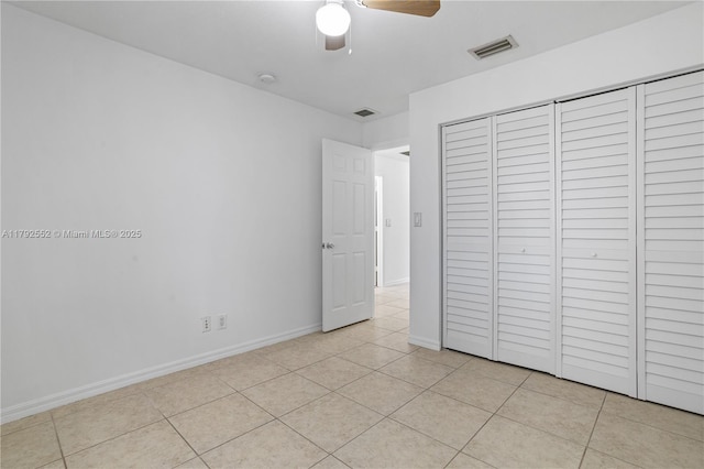 330 SW 2nd Ave Unit 3, Hallandale Beach, FL 33009 - unfurnished bedroom featuring baseboards, visible vents, light tile patterned floors, and a closet