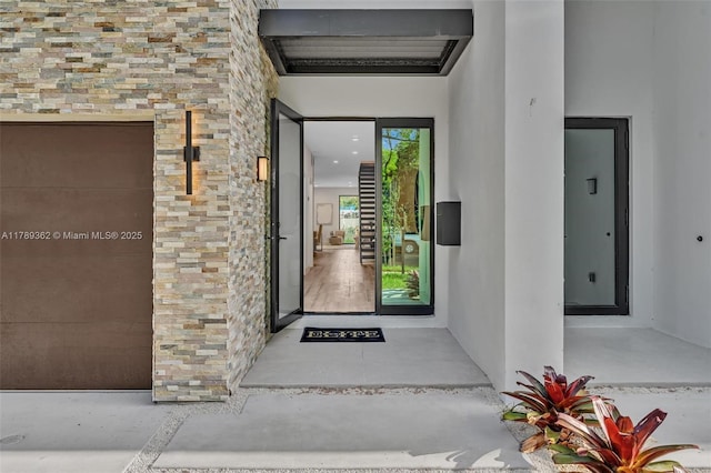 1389 SW 22nd Ter, Miami, FL 33145 - doorway to property with stucco siding and stone siding