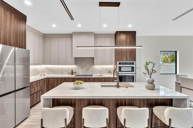 1389 SW 22nd Ter, Miami, FL 33145 - kitchen featuring light countertops, a sink, appliances with stainless steel finishes, and modern cabinets