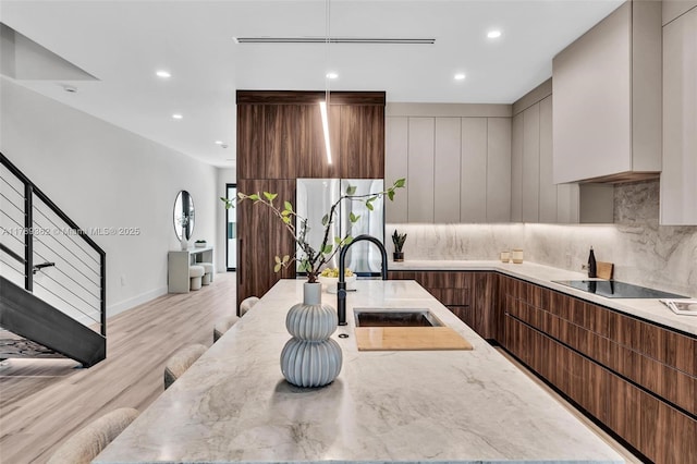 1389 SW 22nd Ter, Miami, FL 33145 - kitchen featuring a sink, light wood finished floors, modern cabinets, and freestanding refrigerator