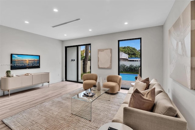 1389 SW 22nd Ter, Miami, FL 33145 - living area featuring recessed lighting, visible vents, and wood finished floors
