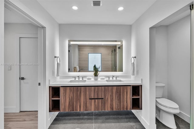 1389 SW 22nd Ter, Miami, FL 33145 - full bathroom with double vanity, toilet, visible vents, and a sink
