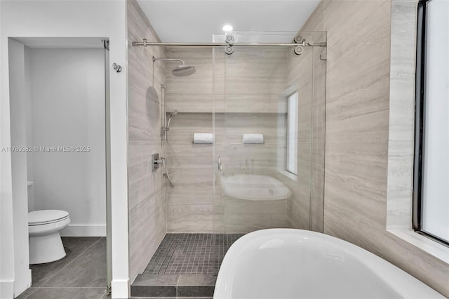 1389 SW 22nd Ter, Miami, FL 33145 - full bath with tile patterned floors, a stall shower, toilet, and a soaking tub