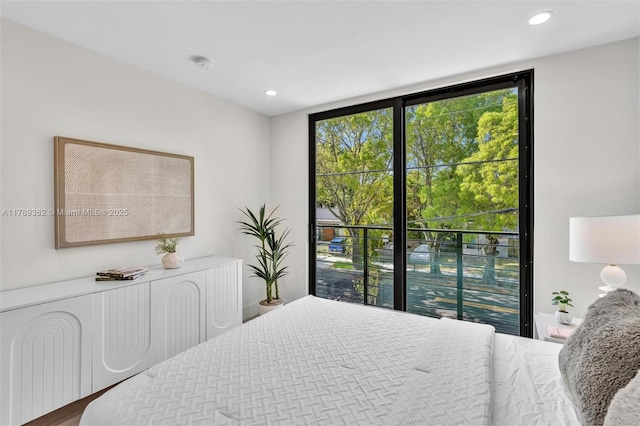 1389 SW 22nd Ter, Miami, FL 33145 - bedroom with recessed lighting, wood finished floors, and a wall of windows
