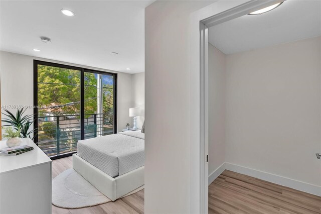 1389 SW 22nd Ter, Miami, FL 33145 - bedroom featuring light wood-type flooring, recessed lighting, baseboards, and access to exterior