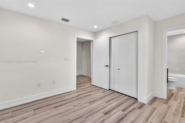 1389 SW 22nd Ter, Miami, FL 33145 - unfurnished bedroom with baseboards, a closet, light wood-style flooring, and visible vents