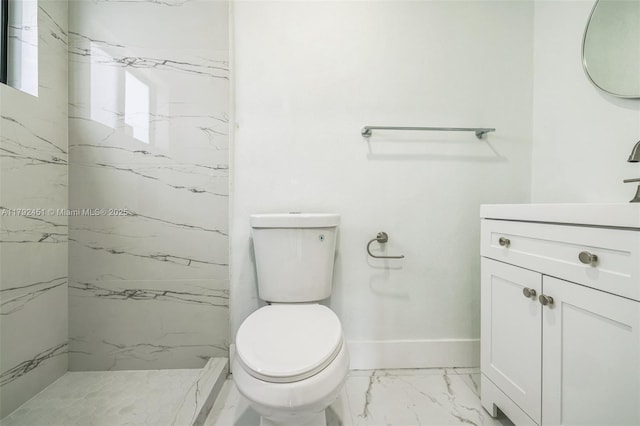 full bathroom with walk in shower, vanity, baseboards, toilet, and marble finish floor