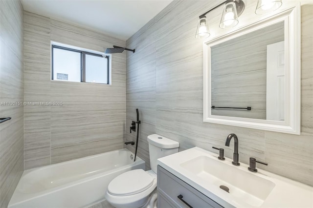 full bathroom featuring vanity, toilet, tile walls, tasteful backsplash, and  shower combination