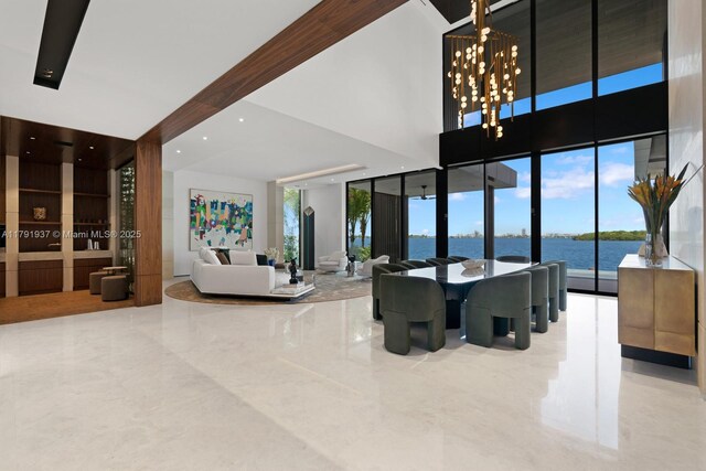 11404 N Bayshore Dr, North Miami, FL 33181 - community lobby with a wall of windows, a water view, and a towering ceiling