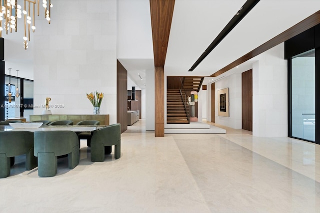 11404 N Bayshore Dr, North Miami, FL 33181 - dining area featuring stairway and a high ceiling