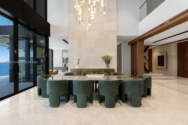 11404 N Bayshore Dr, North Miami, FL 33181 - lobby featuring a towering ceiling, a wall of windows, and stairs