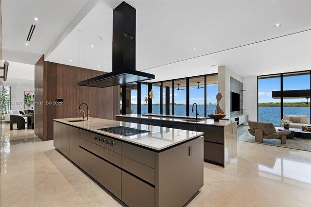 11404 N Bayshore Dr, North Miami, FL 33181 - kitchen featuring modern cabinets, a large island, a sink, floor to ceiling windows, and recessed lighting