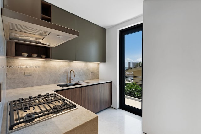 11404 N Bayshore Dr, North Miami, FL 33181 - kitchen with wall chimney exhaust hood, open shelves, a sink, tasteful backsplash, and stainless steel gas cooktop