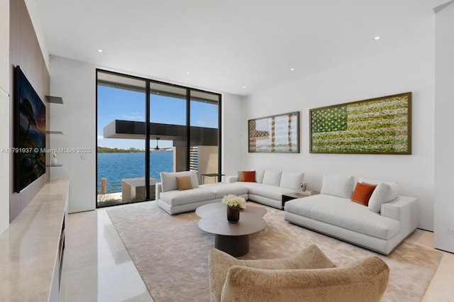 11404 N Bayshore Dr, North Miami, FL 33181 - living room featuring expansive windows, a water view, and recessed lighting