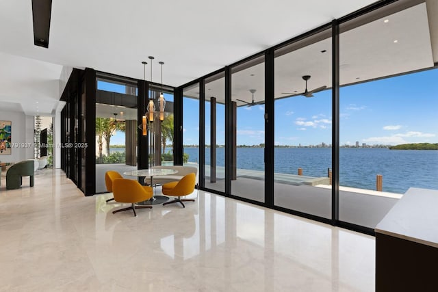 11404 N Bayshore Dr, North Miami, FL 33181 - dining space featuring a water view, expansive windows, and ceiling fan