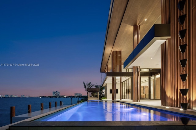 11404 N Bayshore Dr, North Miami, FL 33181 - view of pool with an infinity pool and a water view