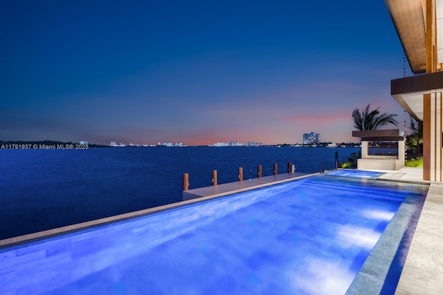 11404 N Bayshore Dr, North Miami, FL 33181 - view of pool with a water view and a pool with connected hot tub