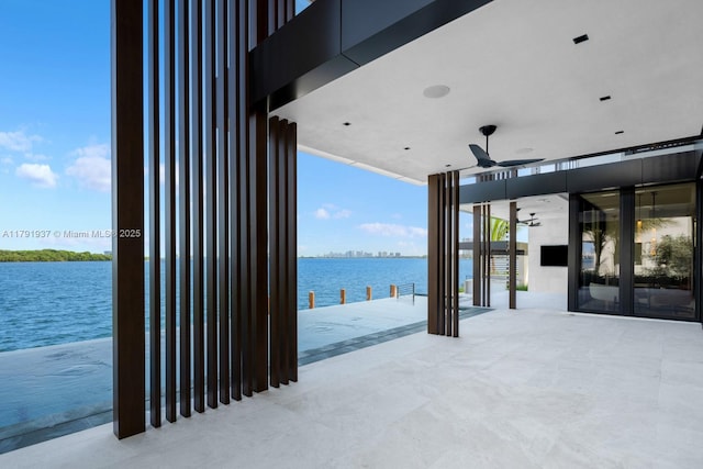11404 N Bayshore Dr, North Miami, FL 33181 - view of patio / terrace with a water view and ceiling fan