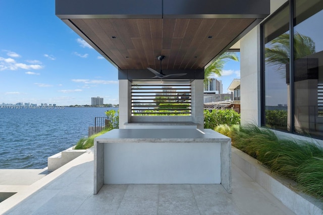 11404 N Bayshore Dr, North Miami, FL 33181 - view of patio with a water view, ceiling fan, and a city view