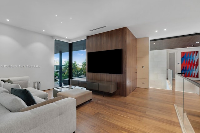 11404 N Bayshore Dr, North Miami, FL 33181 - living area with light wood-style flooring, recessed lighting, and expansive windows