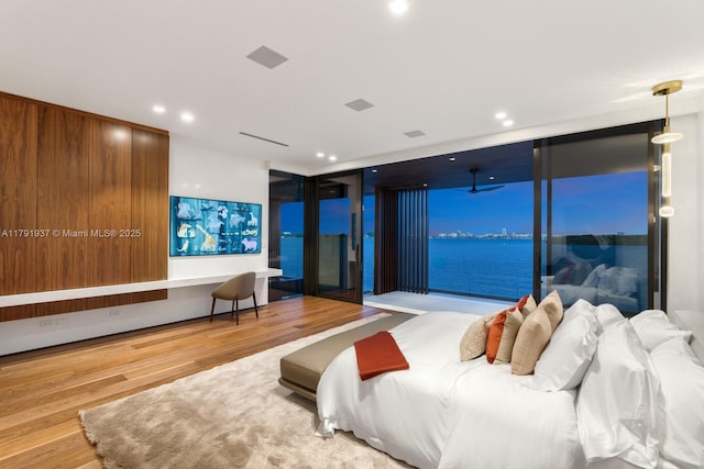 11404 N Bayshore Dr, North Miami, FL 33181 - bedroom featuring wood finished floors, recessed lighting, and access to exterior