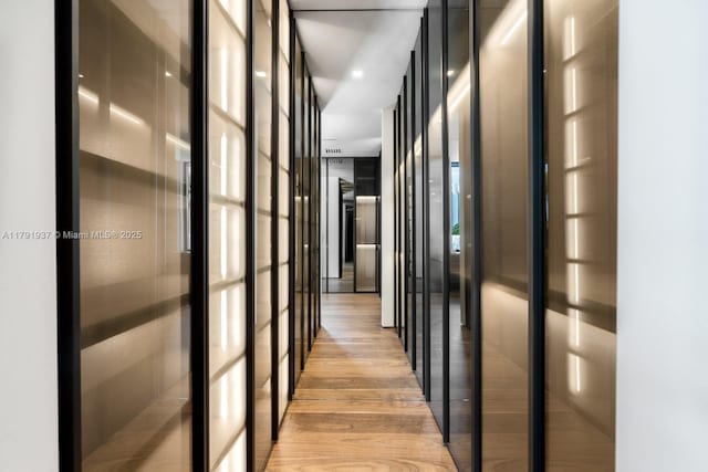 11404 N Bayshore Dr, North Miami, FL 33181 - hallway featuring light wood finished floors