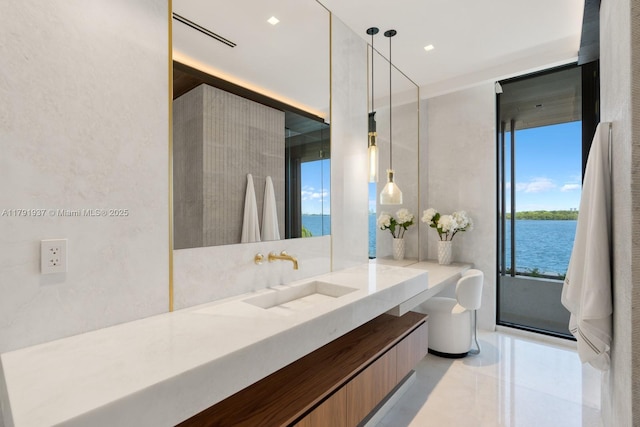 11404 N Bayshore Dr, North Miami, FL 33181 - bathroom featuring vanity, tile patterned floors, and a water view