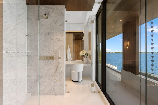 11404 N Bayshore Dr, North Miami, FL 33181 - full bathroom featuring a water view, healthy amount of natural light, and a marble finish shower