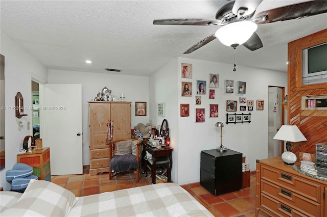 bedroom featuring a textured ceiling, recessed lighting, light tile patterned flooring, and visible vents