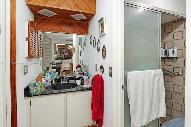 bathroom with vanity and visible vents