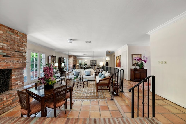 141 Island Dr, Key Biscayne, FL 33149 - dining room with crown molding, baseboards, a brick fireplace, and light tile patterned flooring