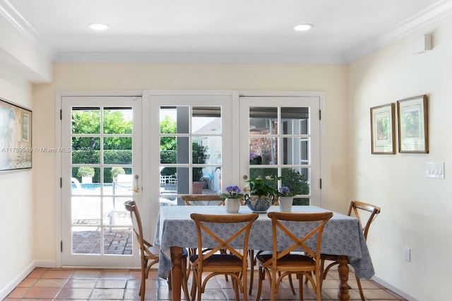 141 Island Dr, Key Biscayne, FL 33149 - dining room with recessed lighting, baseboards, ornamental molding, and french doors