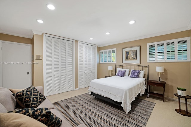 141 Island Dr, Key Biscayne, FL 33149 - bedroom featuring crown molding, baseboards, two closets, carpet flooring, and recessed lighting