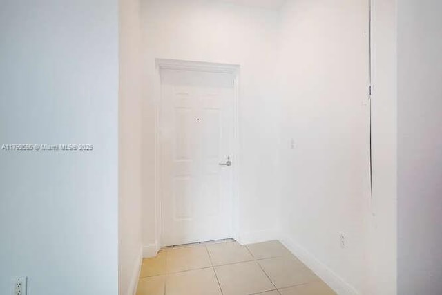 7280 SW 90th St Unit 703, Miami, FL 33156 - corridor with light tile patterned flooring and baseboards