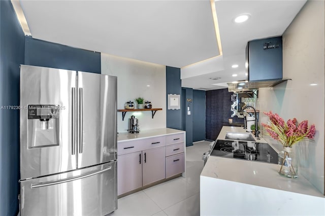 kitchen with open shelves, a sink, light countertops, island range hood, and stainless steel refrigerator with ice dispenser