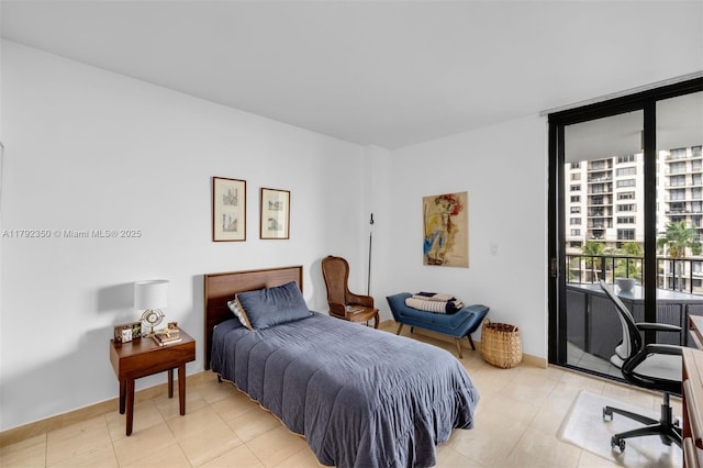 bedroom with light tile patterned floors and access to exterior