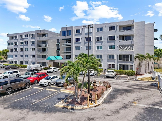 view of property with uncovered parking