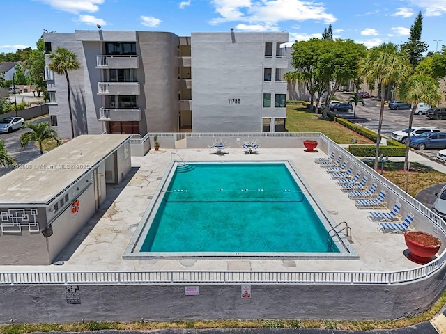 community pool featuring fence