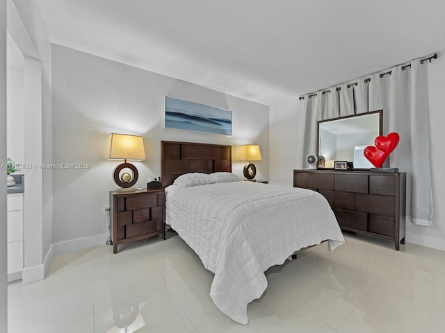 11715 SW 18th St Unit 304, Miami, FL 33175 - bedroom featuring light tile patterned flooring and baseboards