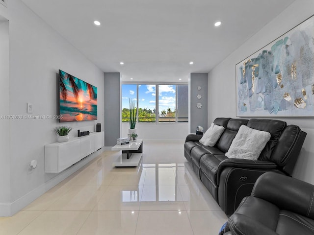 living area with recessed lighting, baseboards, and light tile patterned floors